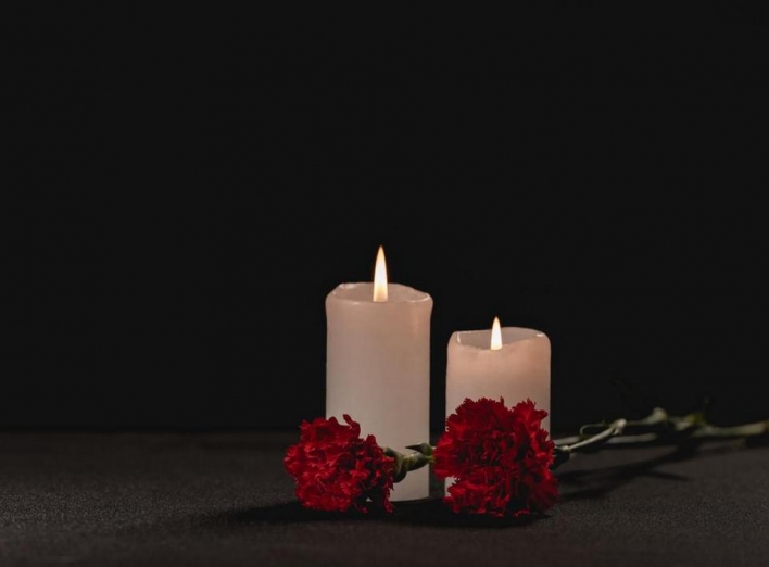 stock-photo-red-carnation-flowers-candles-black.jpg